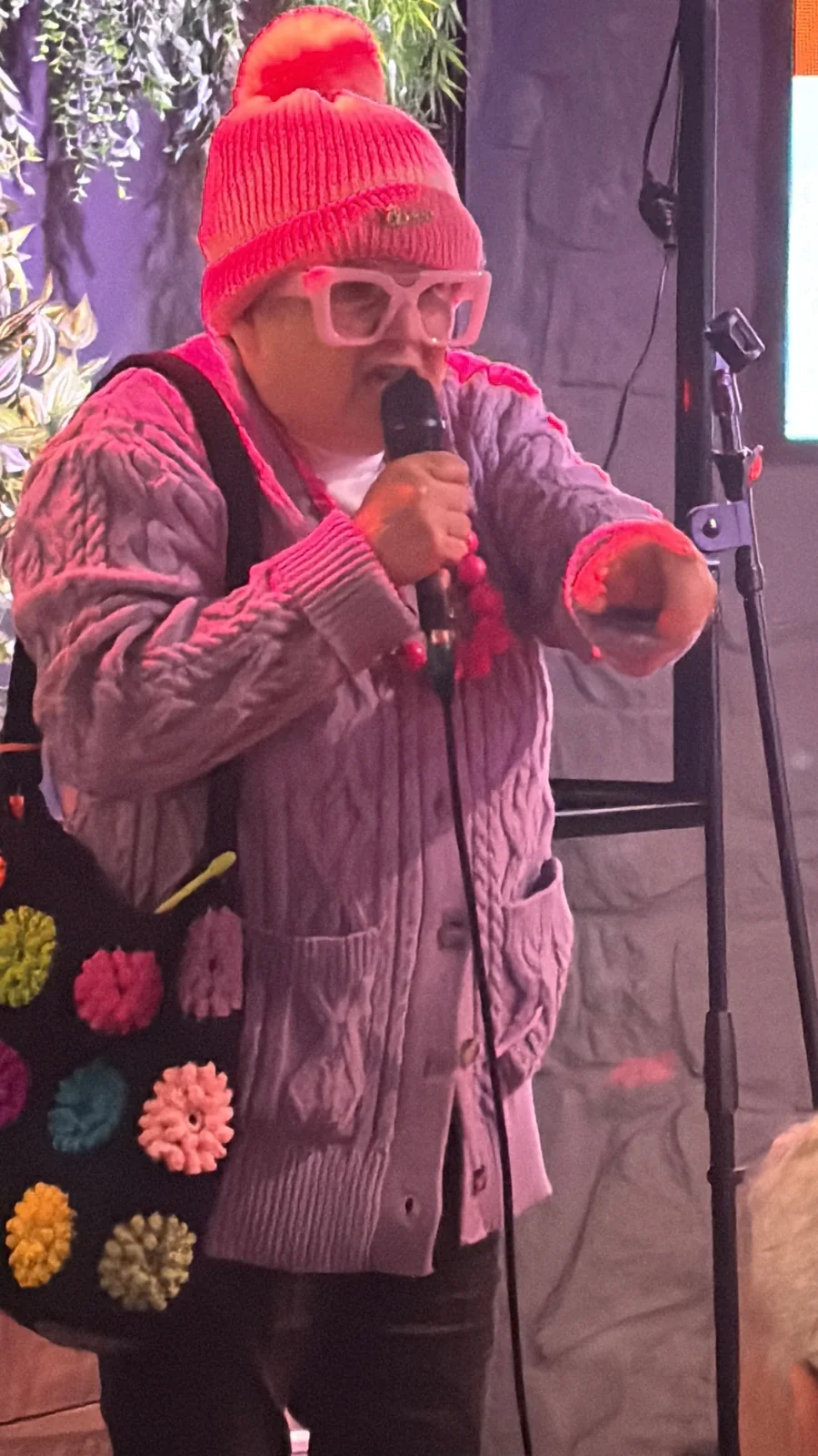 Grandma Poppsie performing with a microphone